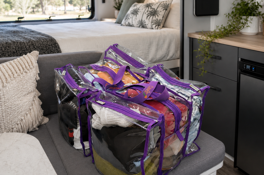 CamPaq Clear Large Camping and Travel Storage Bag filled with winter clothing