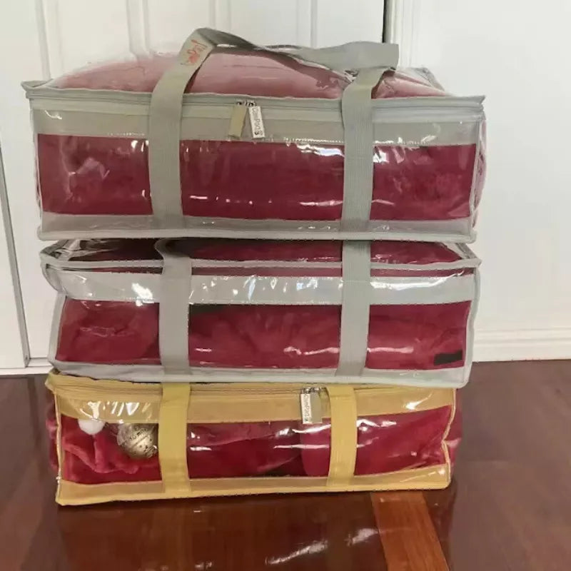 3 clear CamPaq under bed bags stacked filled with blankets