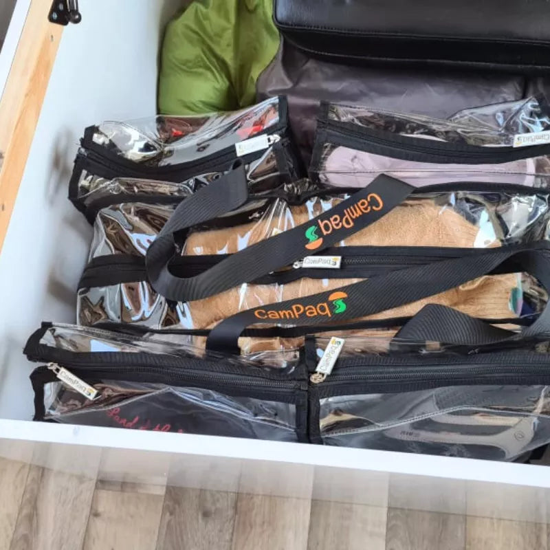 Large black clear camping bag under caravan bed