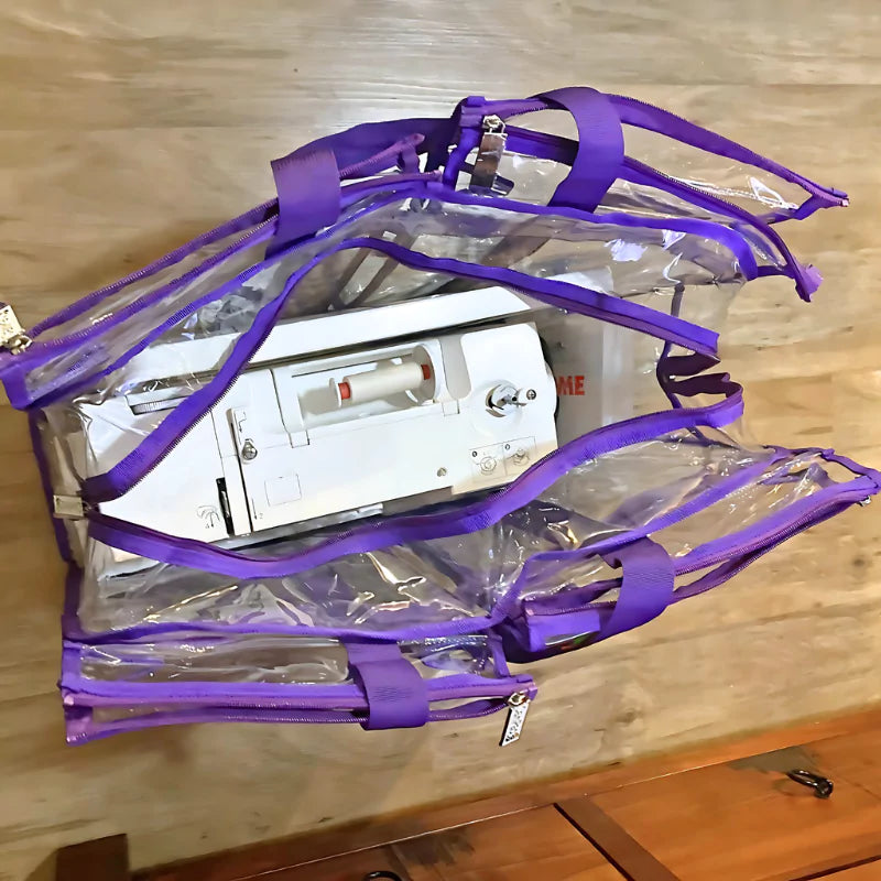 Large purple trim clear CamPaq camping bag with containing sewing machine in centre pocket