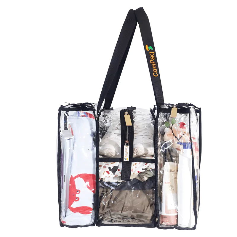 Side view of clear medium black camping bag with black handles displaying various items on a white background