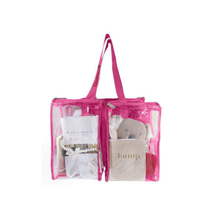 Front view of medium hot pink CamPaq clear bag showing 2 pockets filled with baby gear and top handles