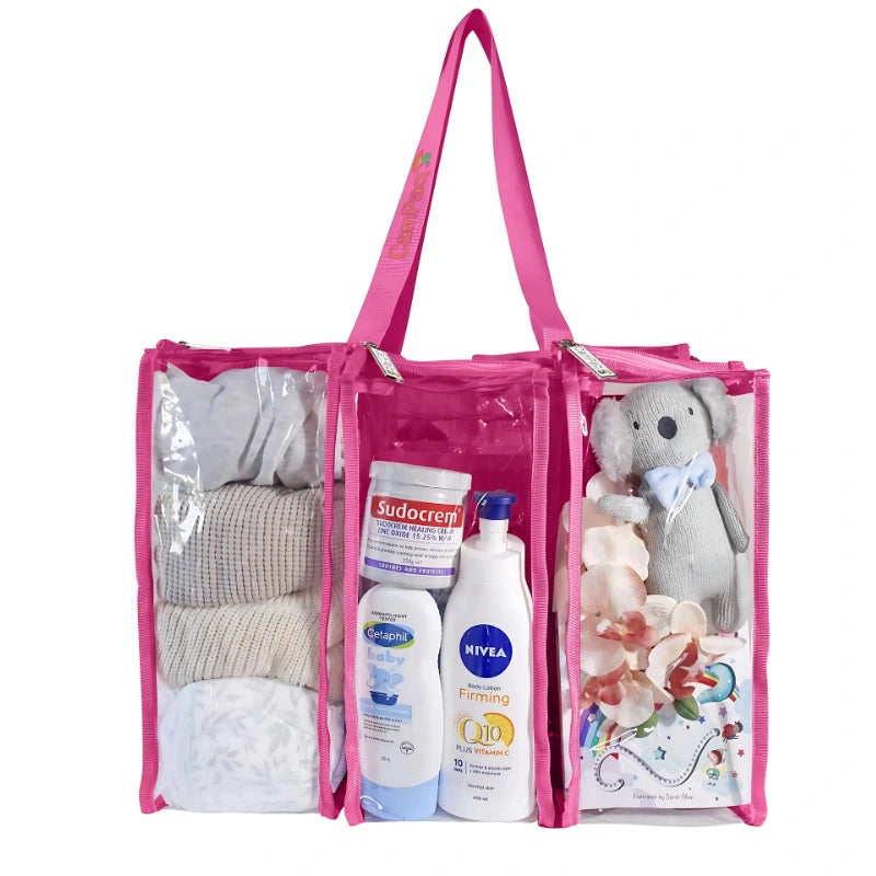 Hot pink medium clear camping bag filled with baby wear, teddy bears and baby toiletry items