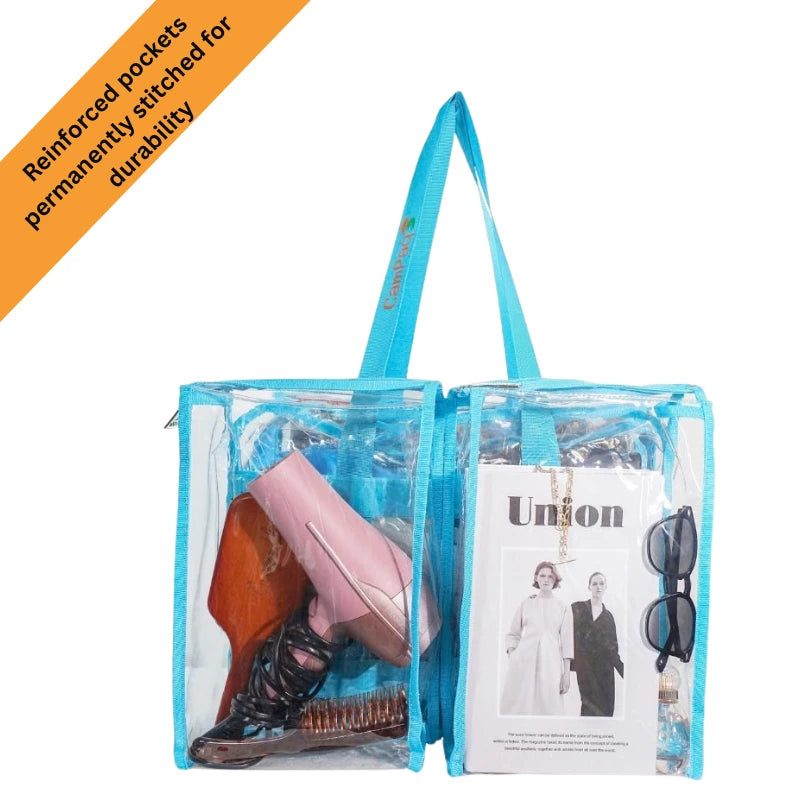 Medium blue clear camPaq camping bag with blue handles containing a shoes, magazine, and sunglasses andhairdryer