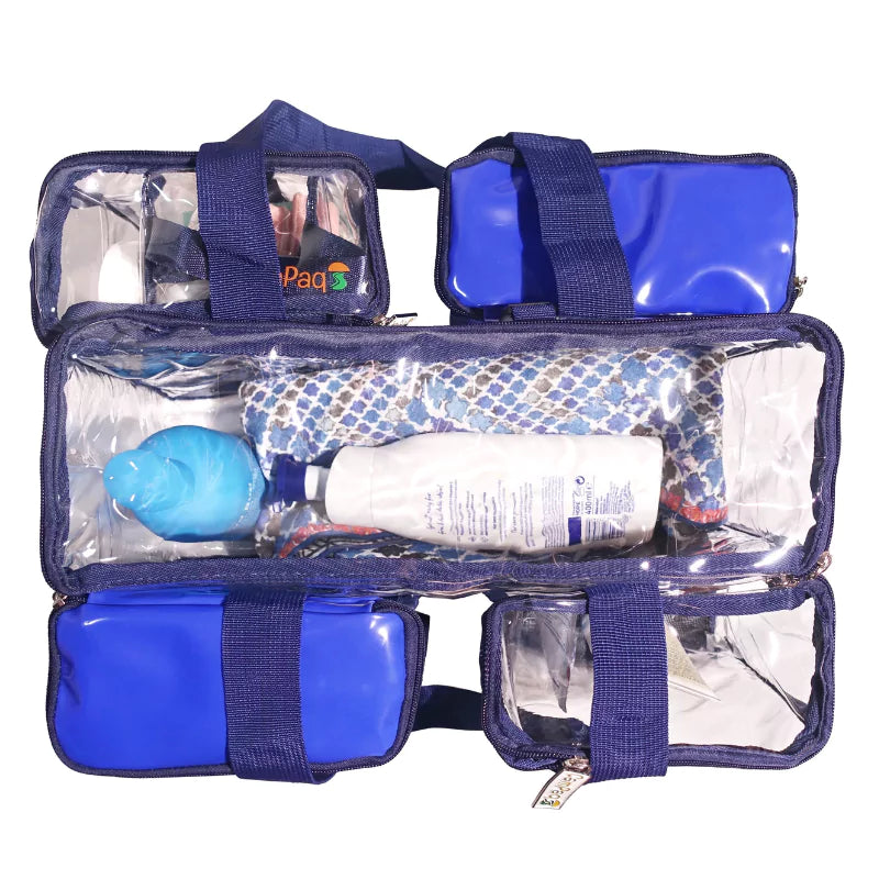 Navy blue clear CamPaq toiletry bag top view with 2 opaque pockets and toiletries