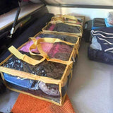 Sand clear under bed storage bag filled with gear under camper bed