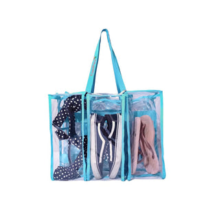 Front 3 pocket view of medium blue CamPaq clear bag filled with shoes